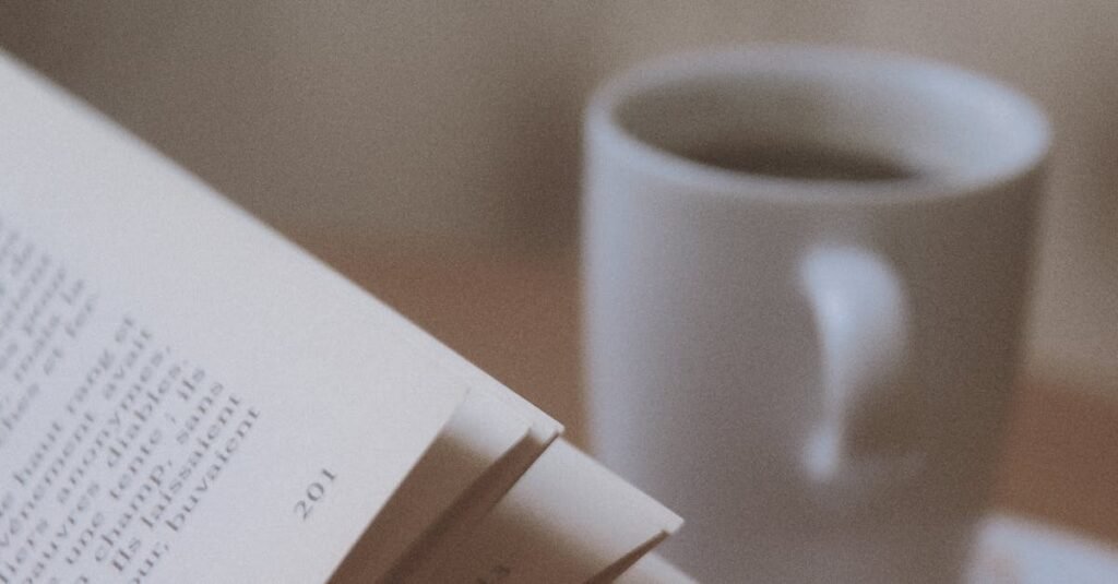 A cozy setup featuring an open book and a steaming mug of coffee, perfect for relaxation.