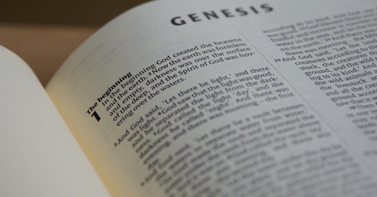 Detailed view of the Book of Genesis in a Bible with selective focus accentuating the text.